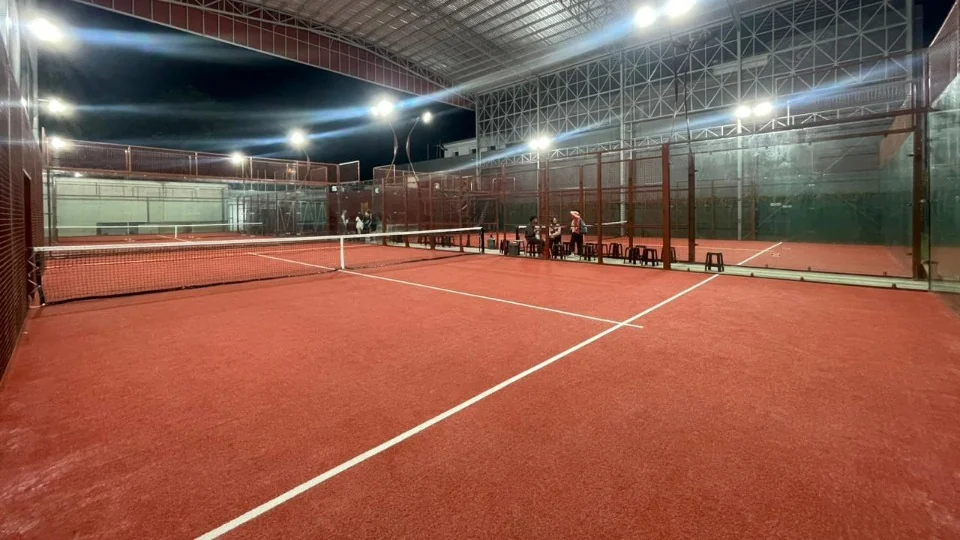 The semi-indoor courts lit up at night