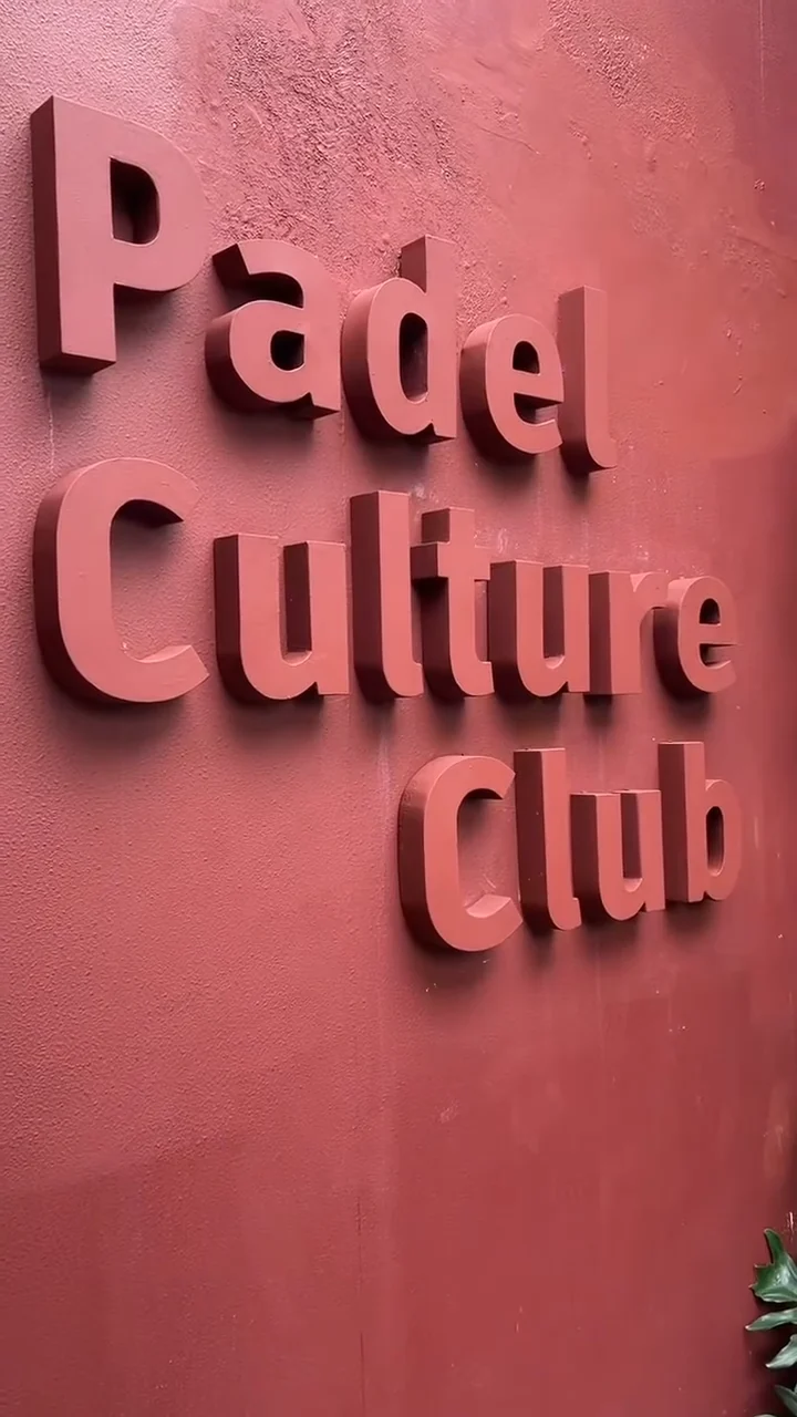 'Padel Culture Club' in raised letters on the terracotta entrance wall